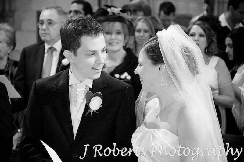 Couple sharing a moment during wedding ceremony at St Thomas' North Sydney - wedding photography sydney